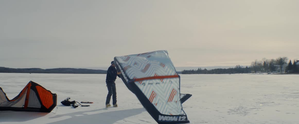 A person with a kite outdoors