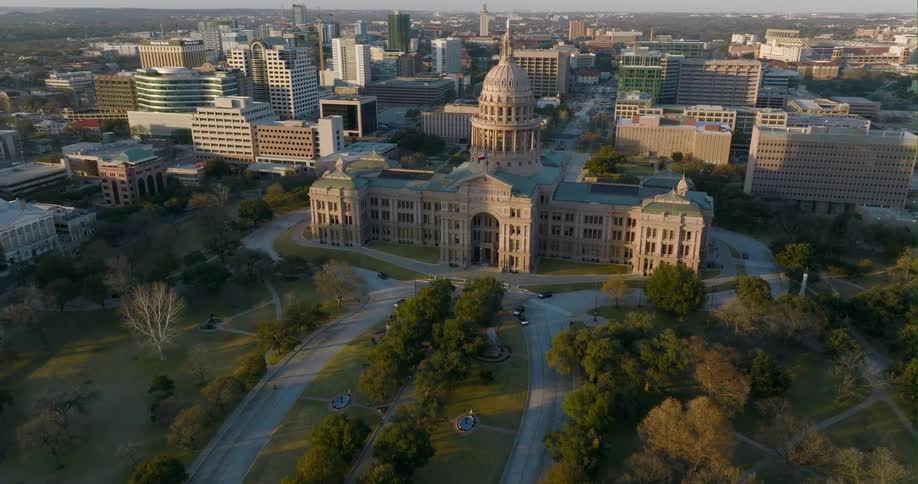 The texas capital building with the city of austin behind