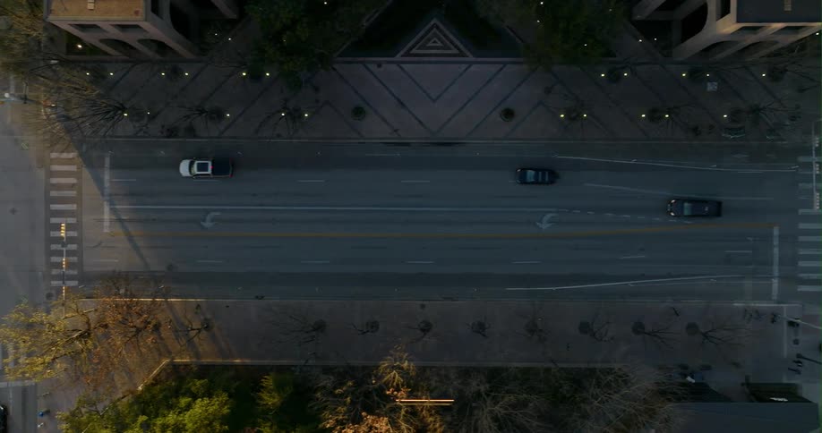 Traffic traveling on wide city streets through intersections