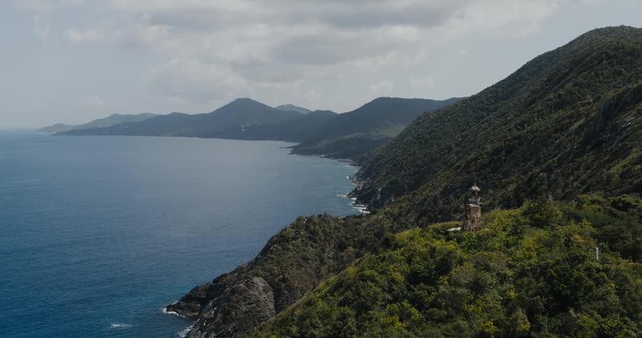An aerial view of a coastline on a cloudy day