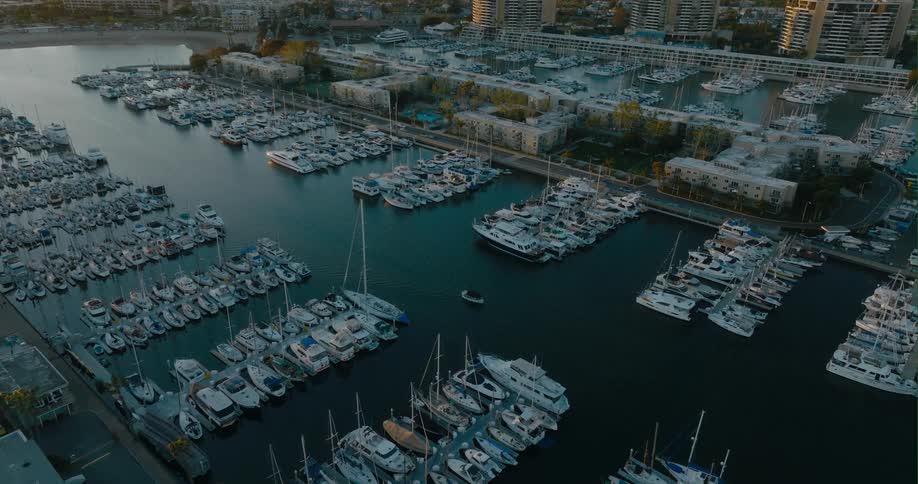 Boats are parked on the pier of the coast