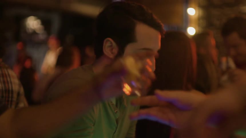 People are at a bar getting drinks