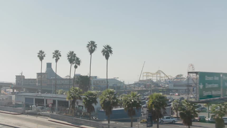 Vehicles drive past the amusement park