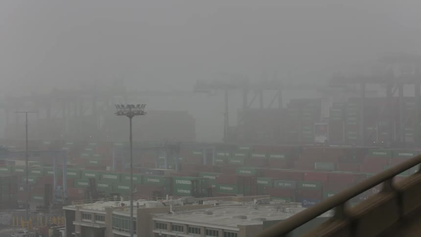 A view of shipping containers in a dock