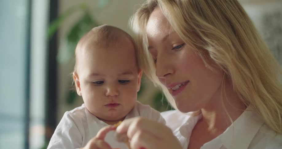 A mother and baby indoors