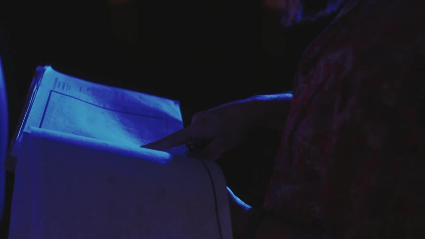 A woman looks through some papers