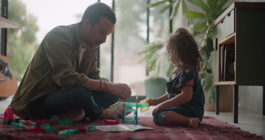 A view of a child and father playing