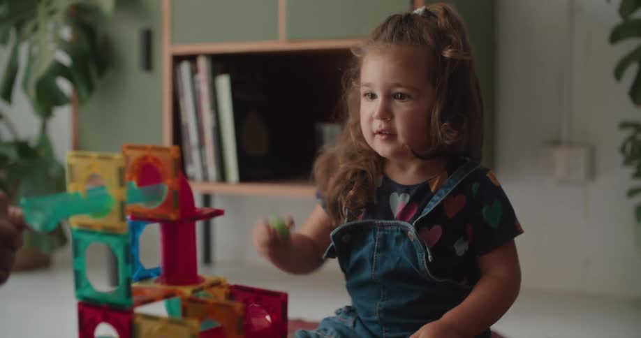 A father and daughter playing in a house