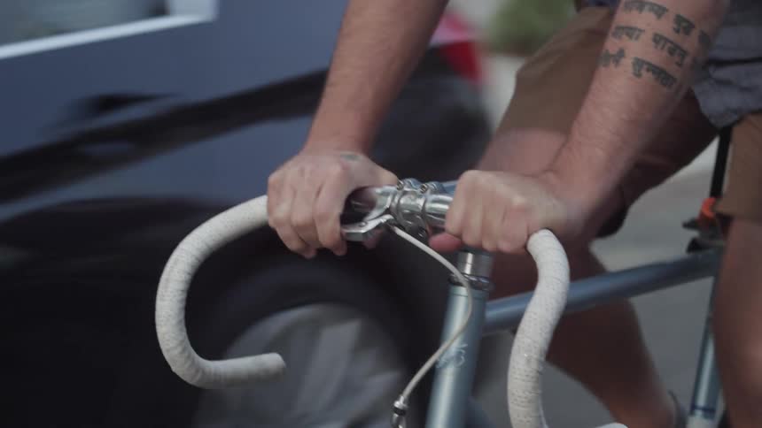 A person rides a bike down the street