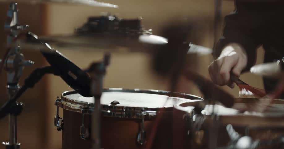 A musician plays the drums
