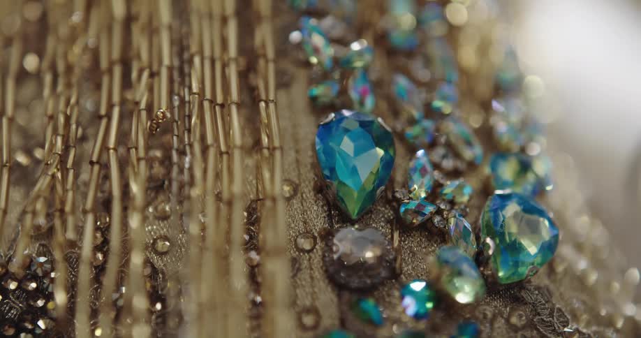 Jewelry made from faceted gems chains and beads lies in columns