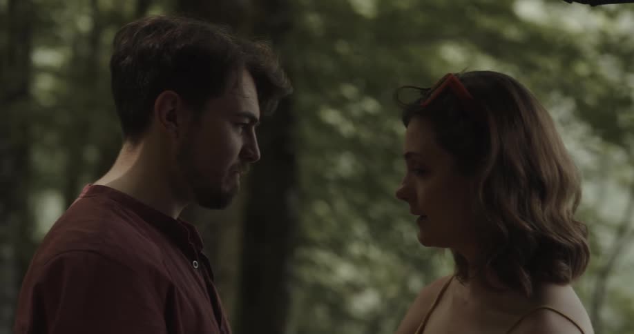 A boyfriend and girlfriend in a forest
