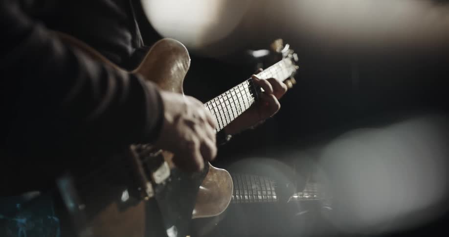 A musician playing an electric guitar