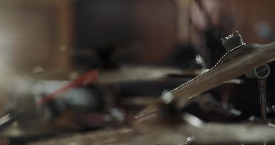 A person hitting a cymbal
