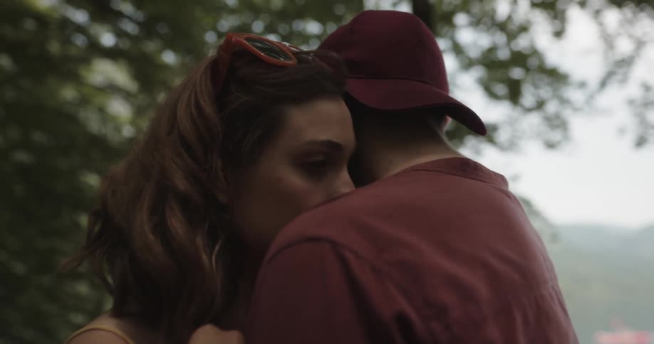 Couple slowly and romantically dancing together outdoors