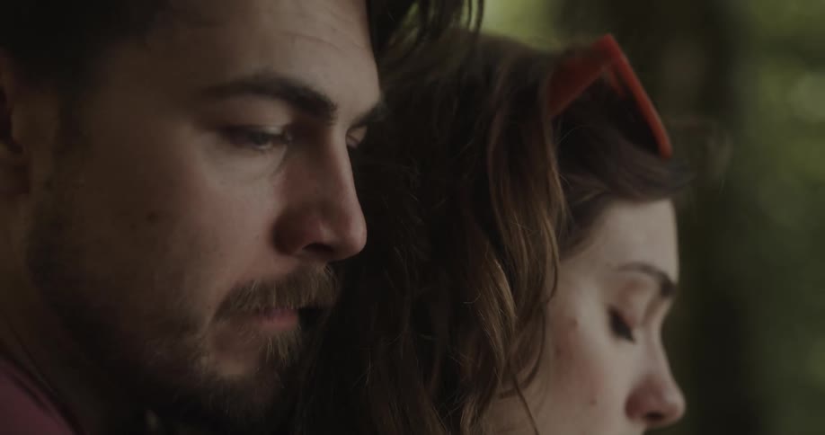 Man and woman are outdoors together in spring