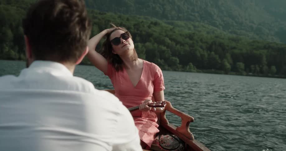 Man and woman are canoeing on a lake during spring