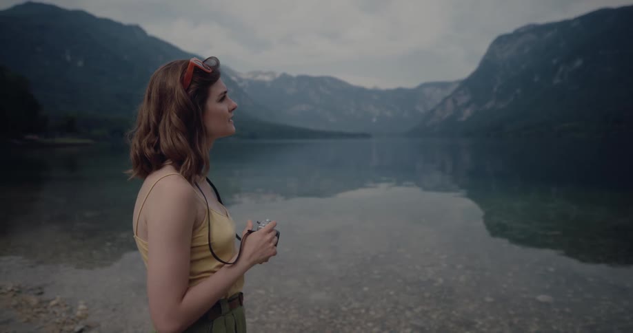 A woman near the edge of a lake