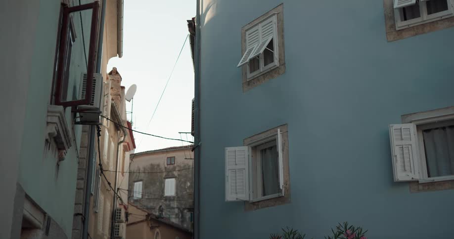 Shutters on apartment buildings sit open