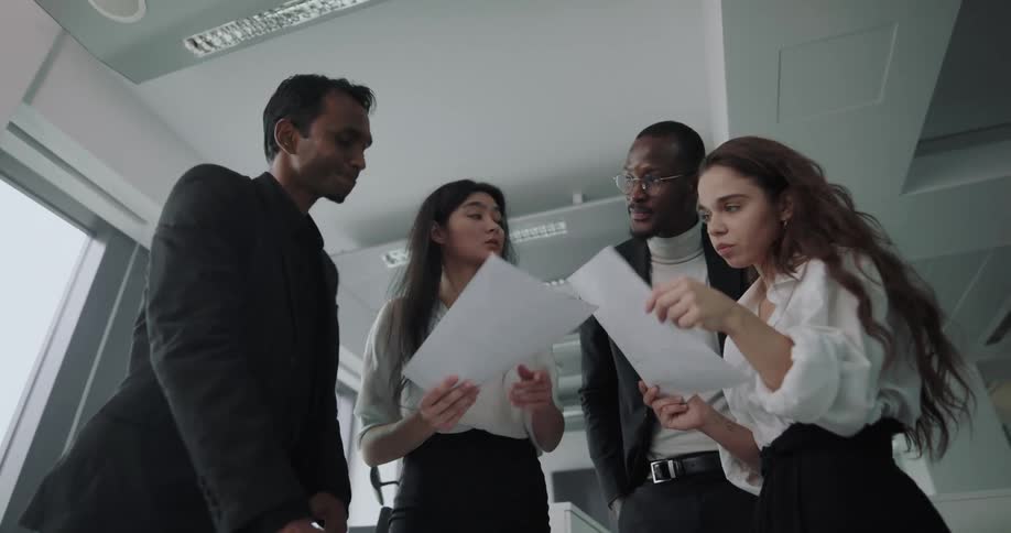 Young adults coworkers brainstorming on a project in an office