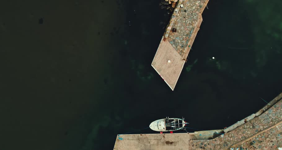 Aerial view of boat lying at anchor in the harbor