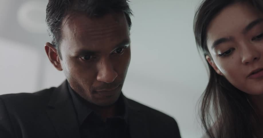 Man and woman are talking together indoors