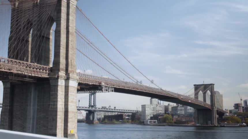A large bridge leads to a city