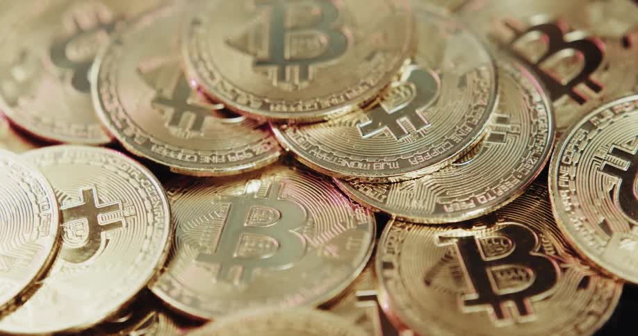 A stack of bitcoin reflects light