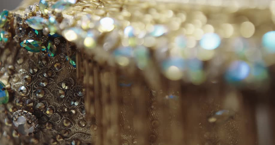 An extreme closeup of a piece of jewelry reveals its intricate composition