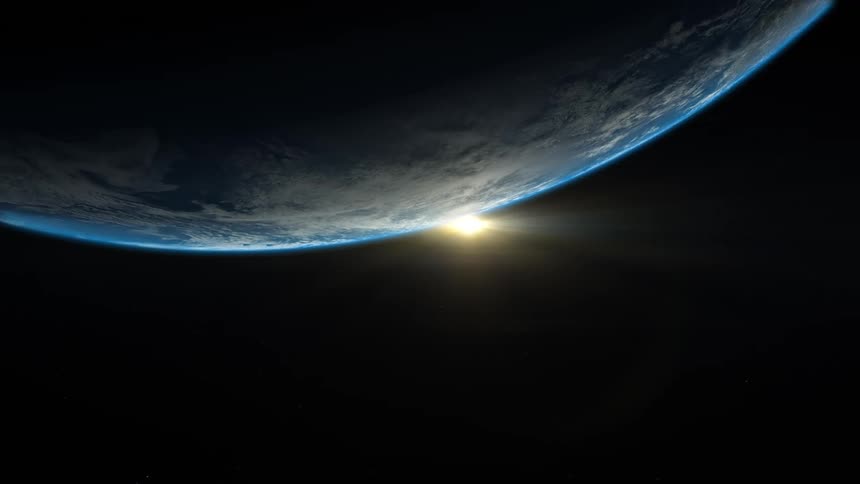 The sun peeks out from behind planet earth
