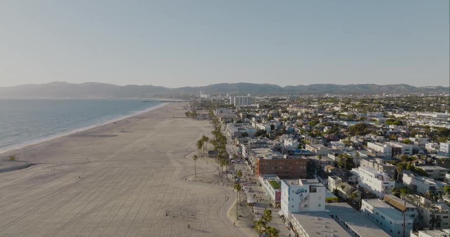 Aerial view of a waterfront city near to the beach close to the ocean at morning