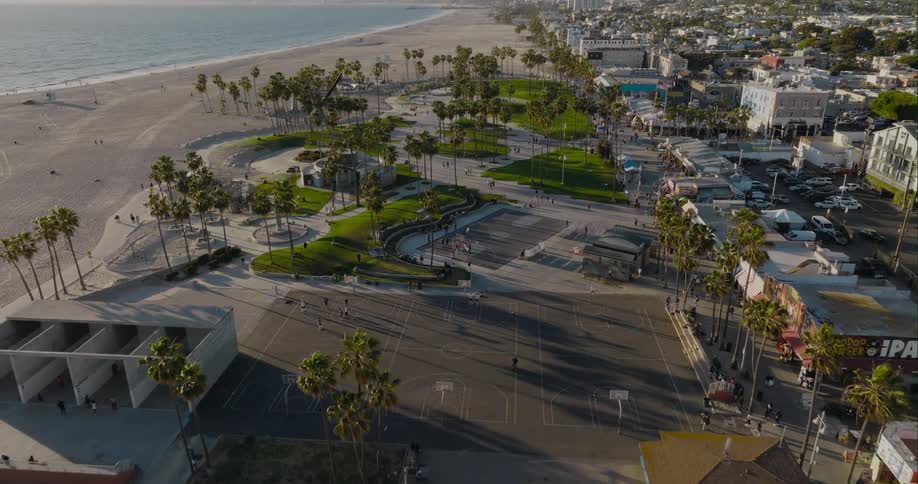 Public sports and recreational facilities along a beach on the coast of a city during the day
