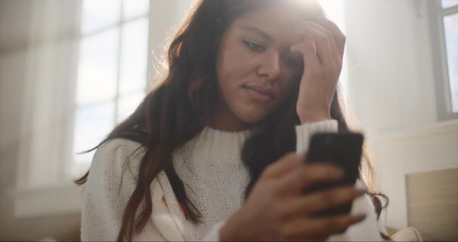 A view of a woman using a smartphone
