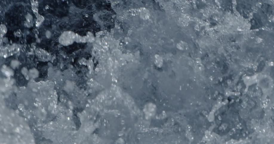 Light reflects on water splashing and foaming