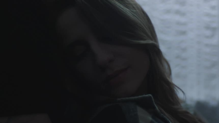 A close up of a woman sleeping