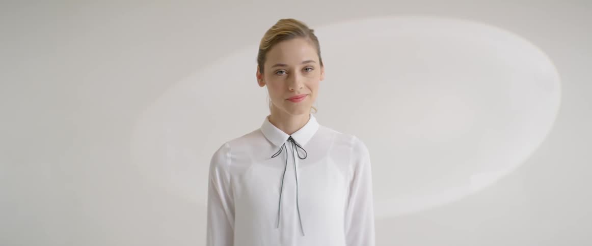 A woman looks up and around