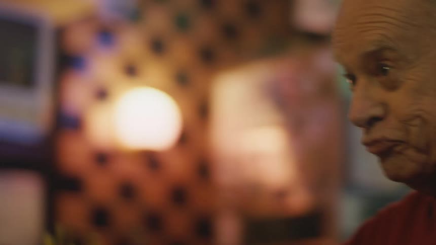 Elderly couple is drinking alcohol at a bar together