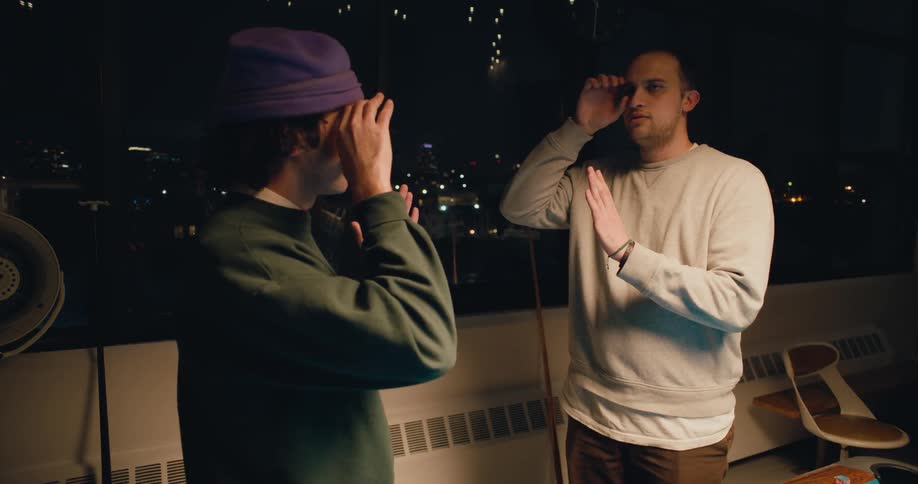 Two friends are communicating together by sign language