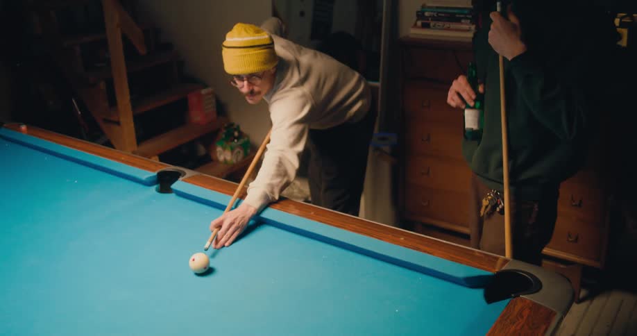 Two friends are playing a game of pool together