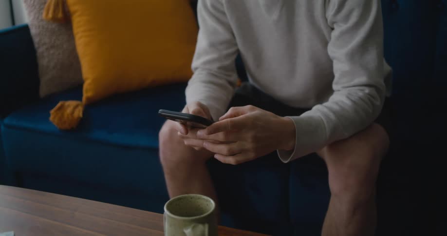 A man uses his cell phone