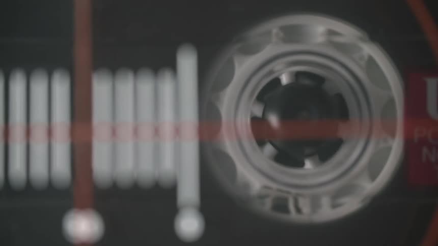 A cassette tape spins as it plays
