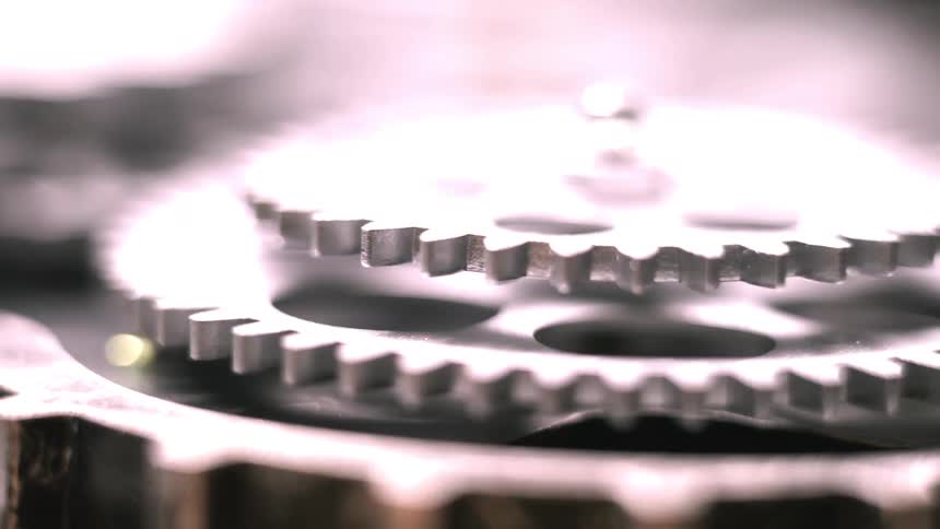 Stacked gears move in unison on a machine