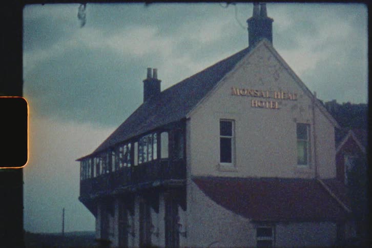 Vintage film footage of an old hotel
