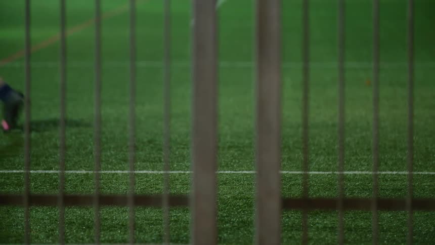 People running outdoors on a soccer field
