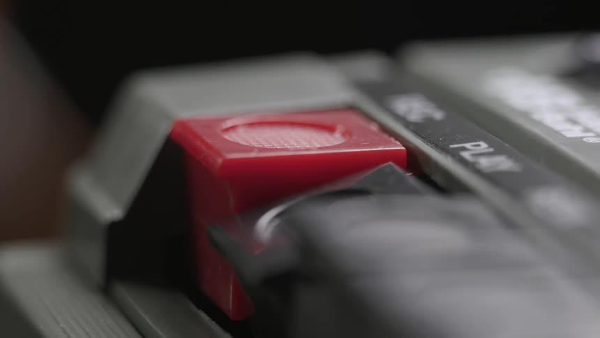 Close up of cassette player with red rec button