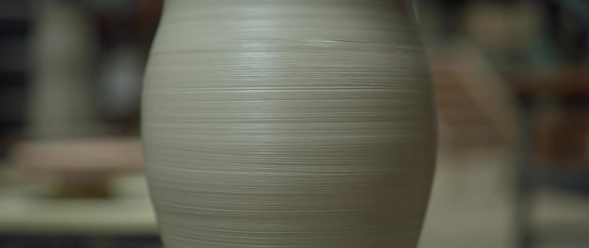 A clay object is spinning on the display