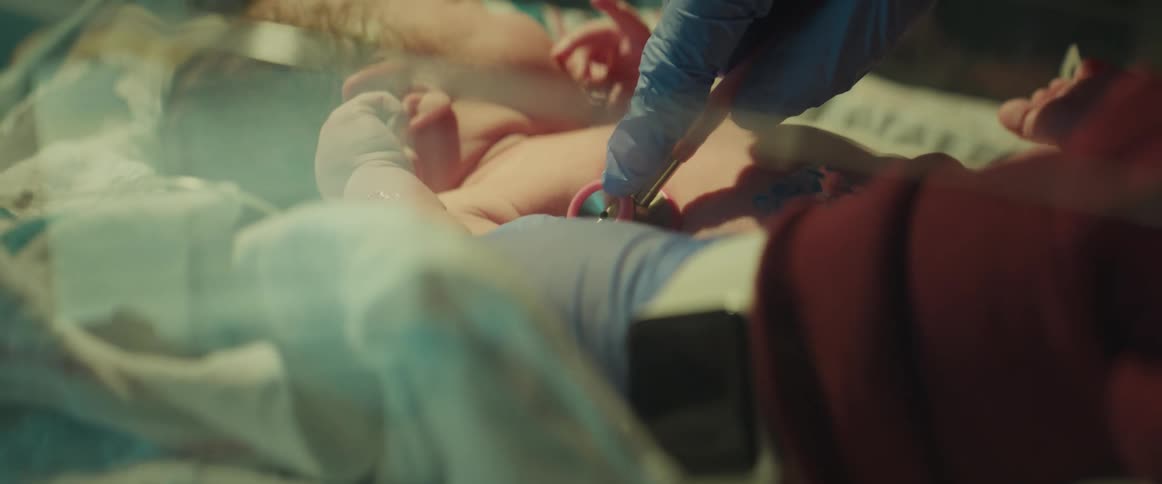 A doctor checking out a newborn baby