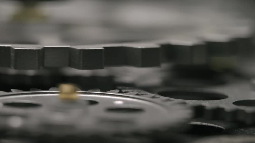 The gears of a machine are turning
