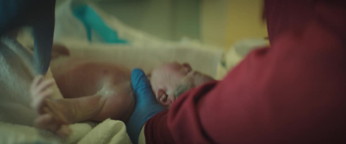 A newborn is cleaned in the hospital
