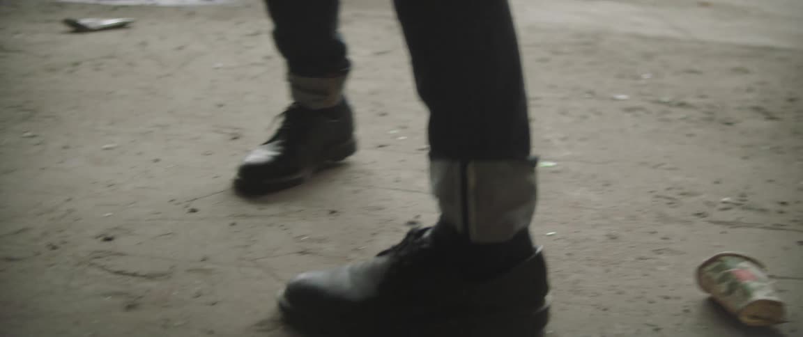 Close up of a persons shoes as theyre walking is displayed